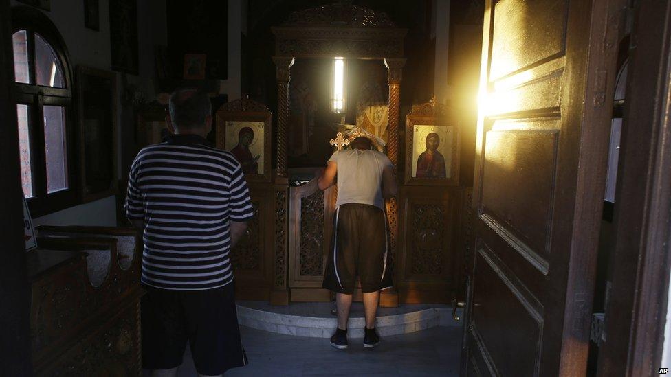 Syrian Christians in a small Greek Orthodox church on the Greek island of Lesbos on Wednesday, 17 June 2015