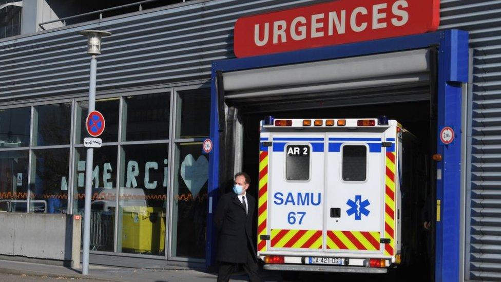 An ambulance enters a hospital in France