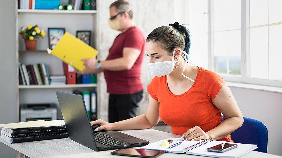 Man and woman in office