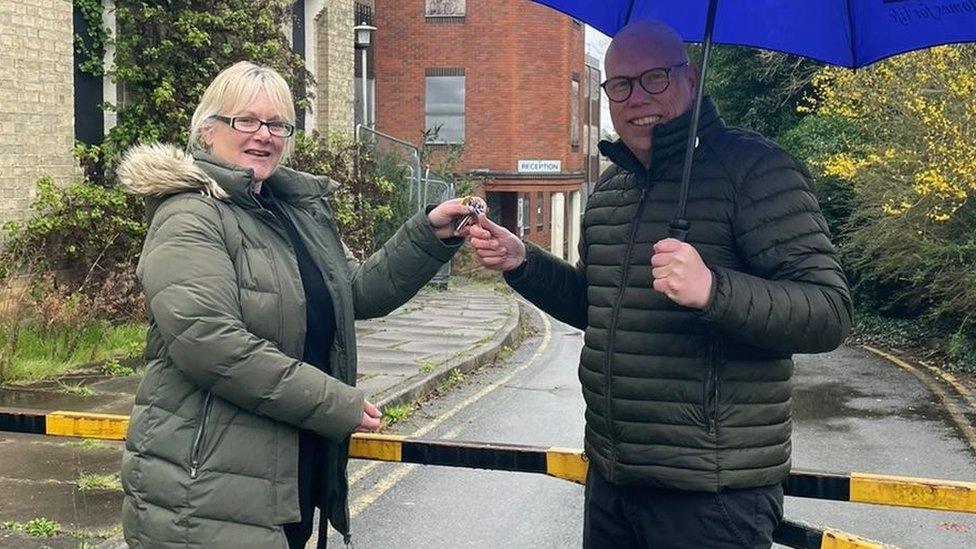 East Suffolk Council delivery manager Laura Hack pictured handing over the keys to the former Melton Hill office site to Alex Leader, sales and marketing director at Rose