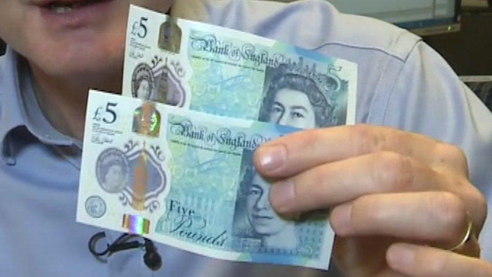 Simon Gompertz with the new £5 notes