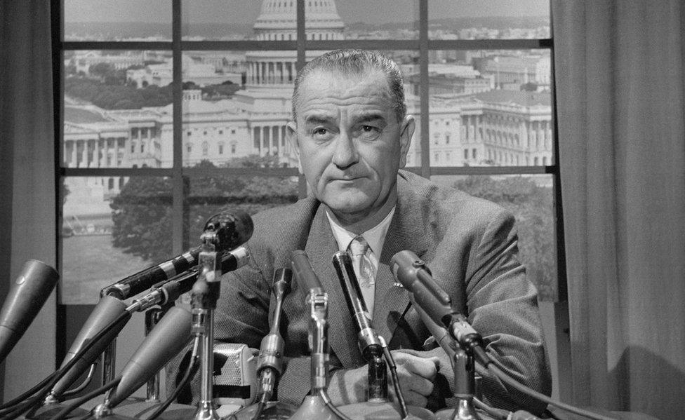 A black and white picture of Lyndon B. Johnson at a press conference