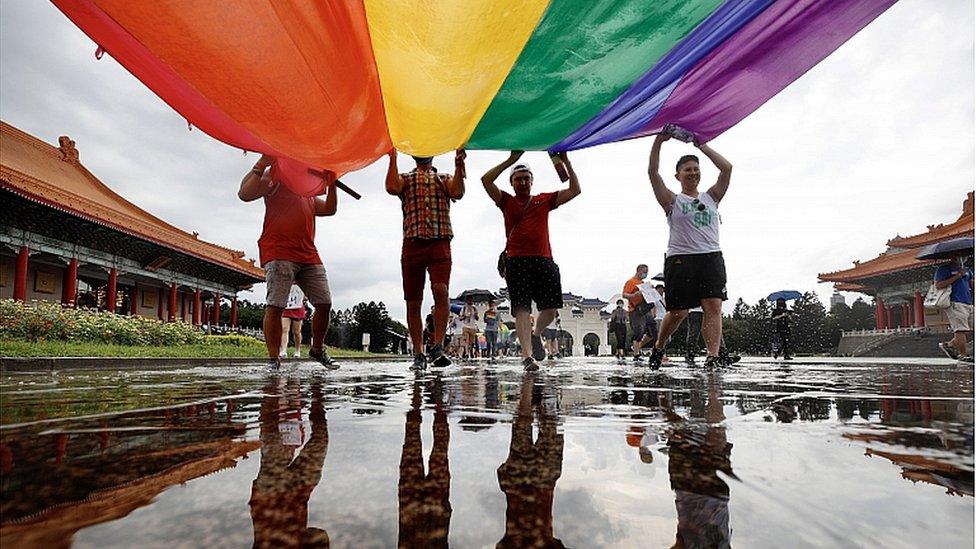 Members of the LGBT community join a march to celebrate the pride month at the National Chiang Kai-shek Memorial Hall in Taipei, Taiwan, 28 June 2020