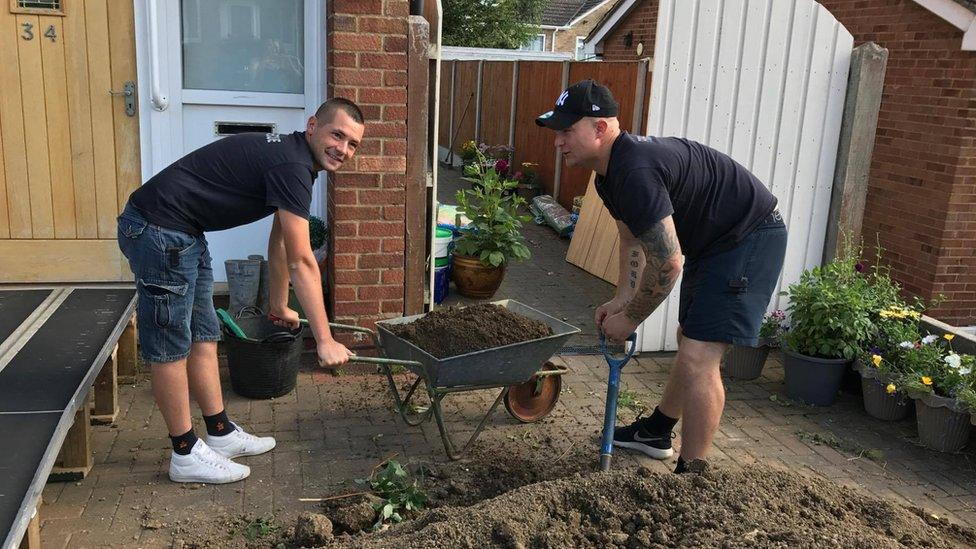 Volunteers working on Darren Black's garden