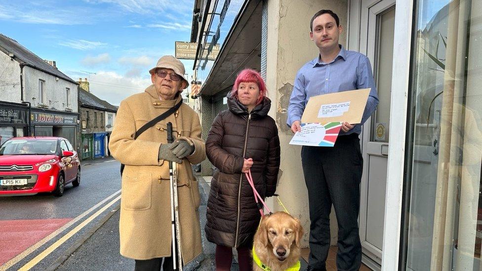 MP Mark Harper accepted the petition outside his constituency office