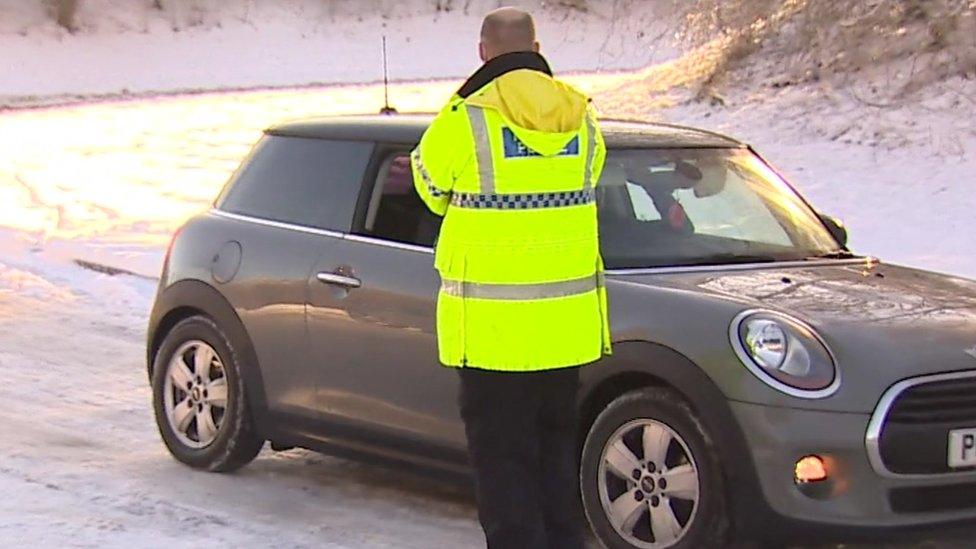 A car is turned away by police at Moel Famau