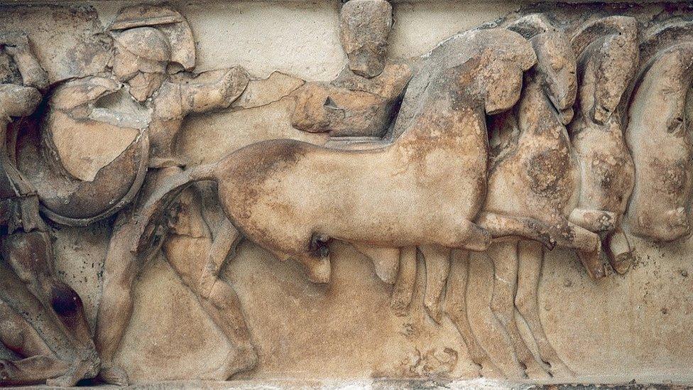 A Siphnian stone relief (530 BC) depicting a scene of the Trojan War: Troy's Aeneas and Ethiopia's Memnon fighting against the Greek heroes Ajax and Achilles. Archaeological Museum of Delphi, Greece.