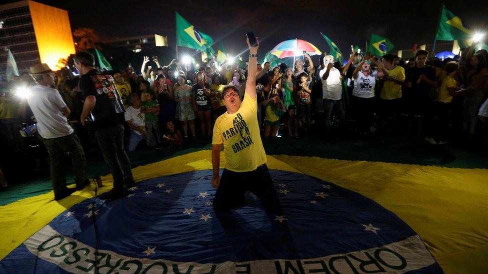 Supporters of Jair Bolsonaro, far-right lawmaker and presidential candidate of the Social Liberal Party (PSL), react after Bolsonaro wins the presidential race, in Brasilia, Brazil October 28, 2018