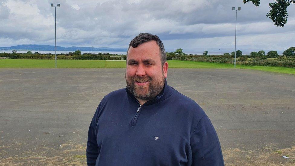 Columba Mailey stands on the pitch in Greysteel