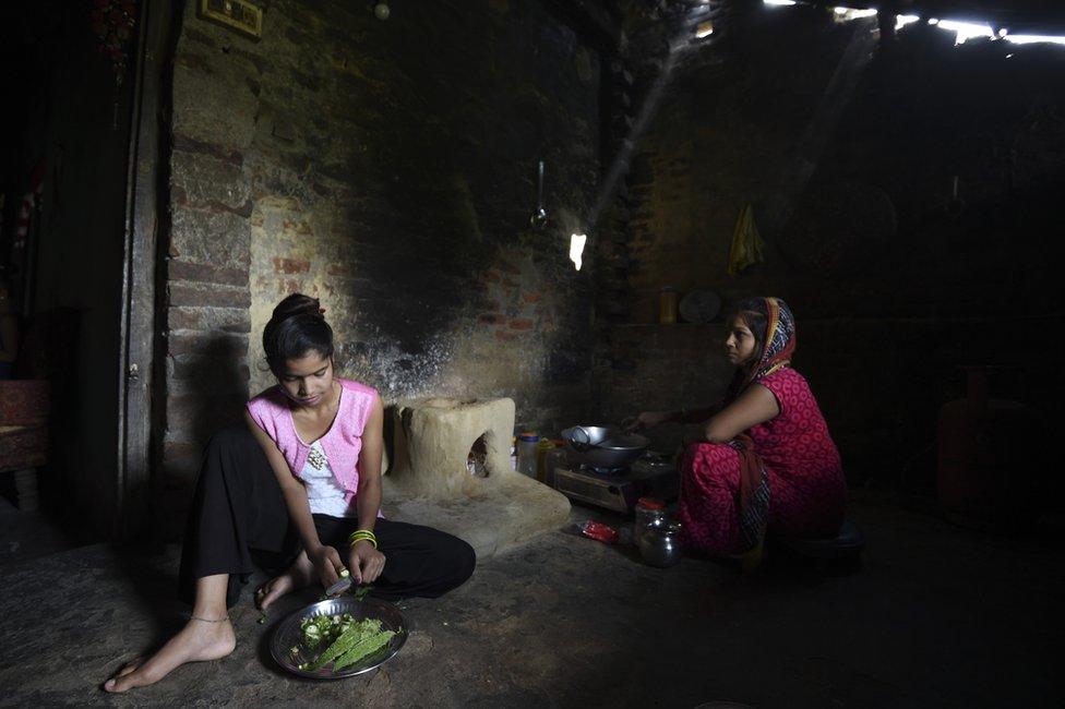 Anjali Patel helps with house chores