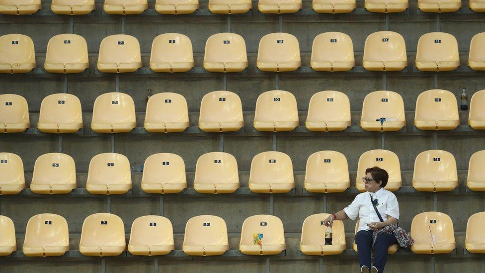 Spectator watches Women's Diving Synchronised 10m Platform Final at Maria Lenk Aquatics Centre on August 9, 2016 in Rio de Janeiro