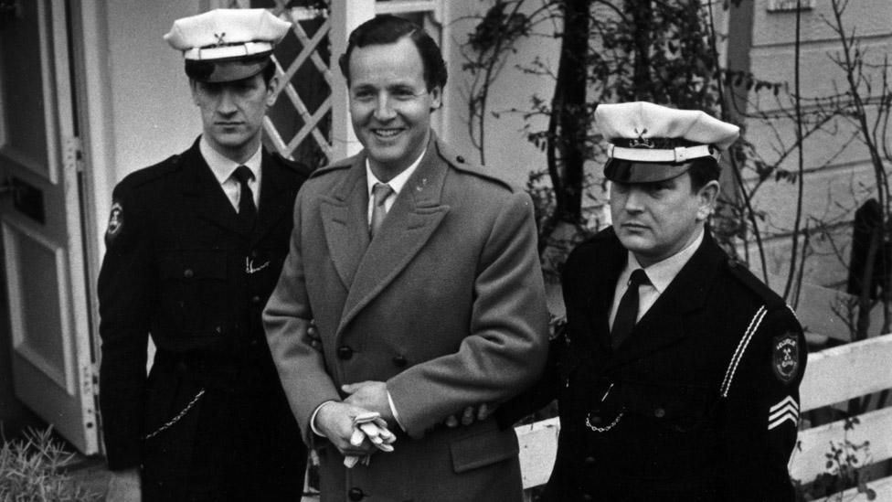 Nicholas Parsons with Securicor guards after a threat to kidnap him in 1967