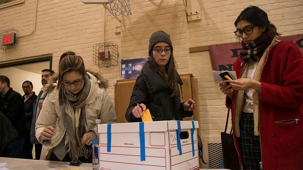 Caucus goers cast their vote at a Democratic party caucus site at Jefferson Community School on Super Tuesday, March 1, 2016 in Minneapolis, Minnesota.