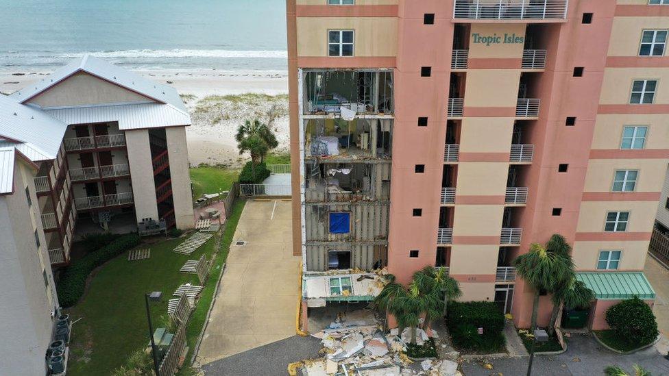 An aerial view from a drone shows an outer wall of the Tropic Isles complex torn off after Hurricane Sally passed through the area on September 17, 2020 in Gulf Shores, Florida