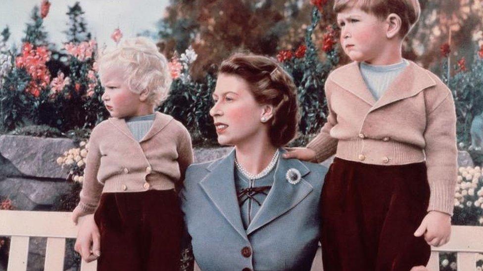 Queen Elizabeth with Prince Charles and Princess Anne in the grounds of Balmoral Castle, Scotland. Charles is celebrating his 4th birthday