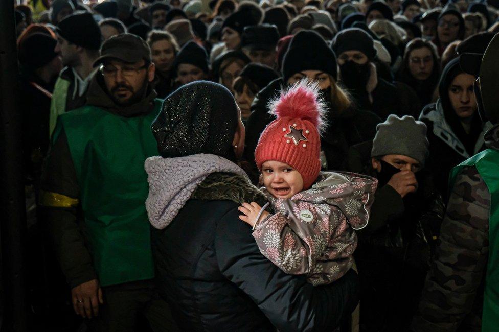 There were some tense moments as volunteer stewards attempted to hold back women and children anxious to make a train out.