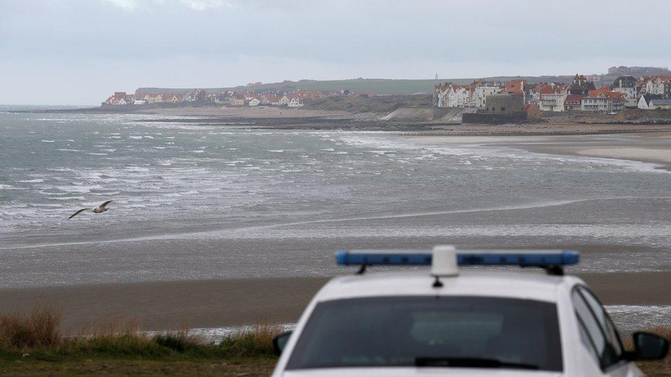 French police patrol near the Slack dunes, the day after 27 migrants died when their dinghy deflated as they attempted to cross the English Channel, in Wimereux, near Calais