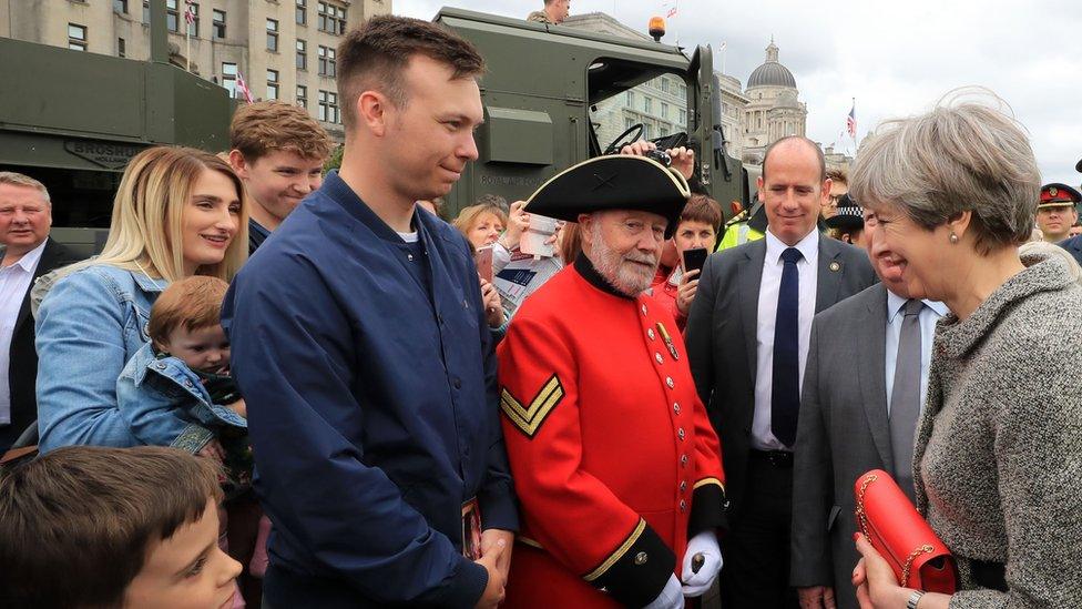 Theresa May speaks to members of the public during Armed Forces Day