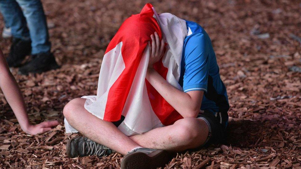 England fan with flag on his head