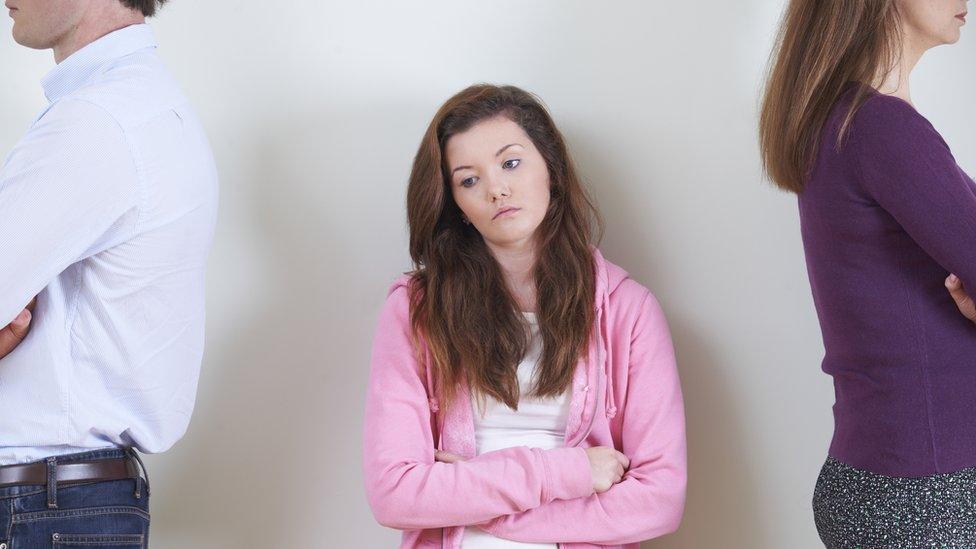 Teenage girl with her parents