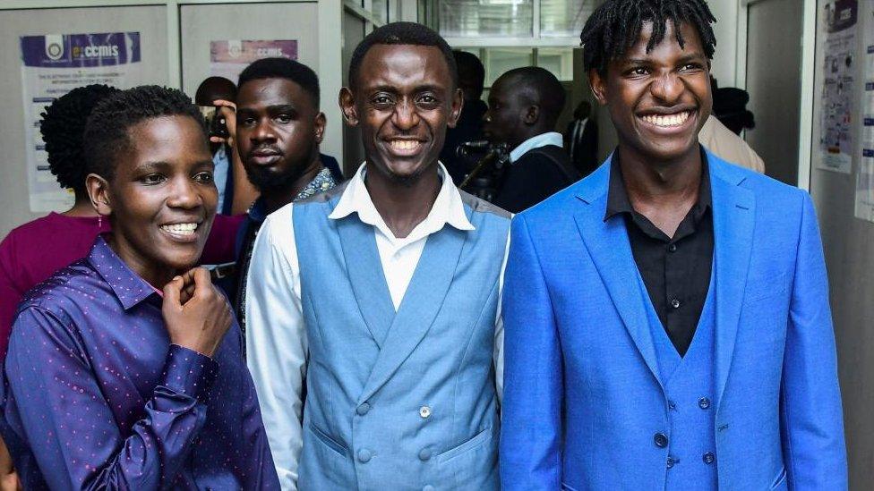 Ugandan LGBTQ activists pose for a photograph after the hearing of petitions and applications challenging the anti-gay law at the Constitutional Court, in Kampala, Uganda December 18, 202