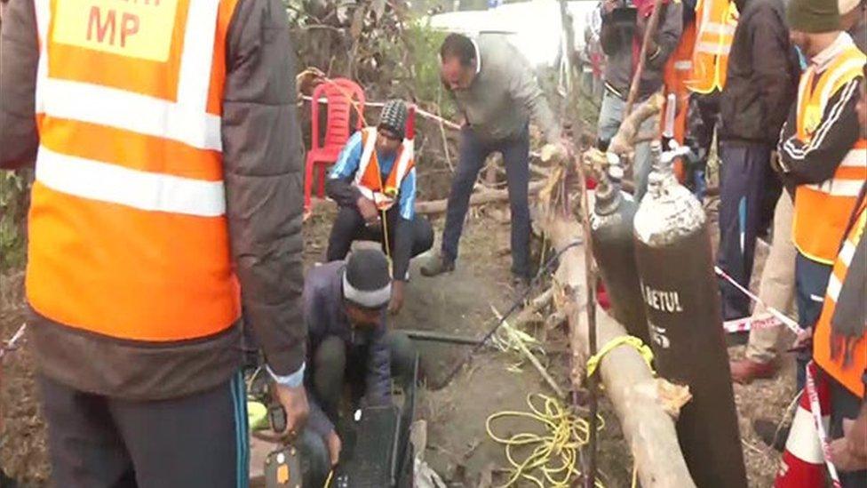 Boy stuck in well