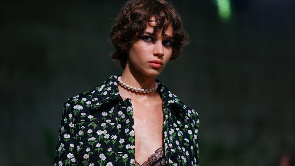 A model presents creations by Gucci at a fashion show in the Turbine Hall at Tate Modern, in London, Britain May 13, 2024.