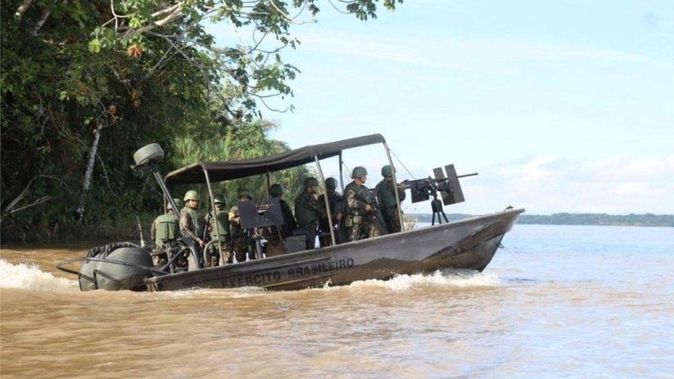 A search team looks for British journalist Dom Phillips and indigenous expert Bruno Pereira, who went missing while reporting in a remote and lawless part of the Amazon rainforest near the border with Peru, in Javari Valley, Brazil, June 5, 2022 in this still image from a video. Video recorded June 5, 2022.