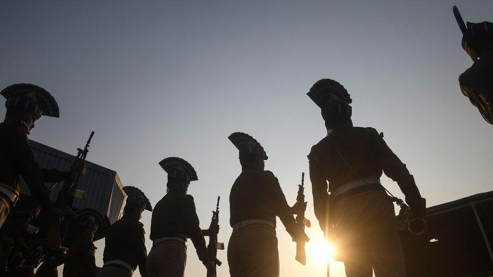 Indian Central Reserve Police Force (CRPF) personnel stand as a guard of honour for colleagues Sudip Biswas and Bablu Santra at Kolkata airport