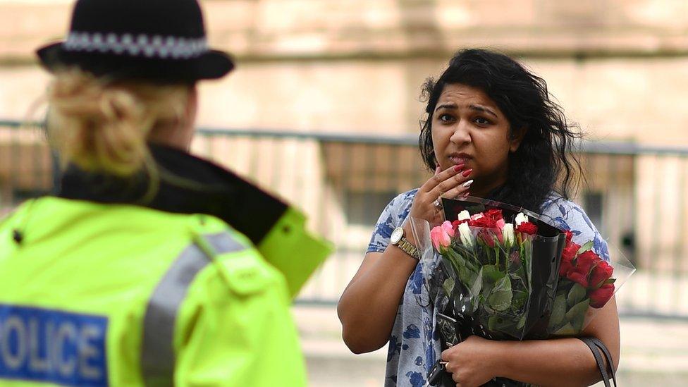 Woman with bunch of flowers