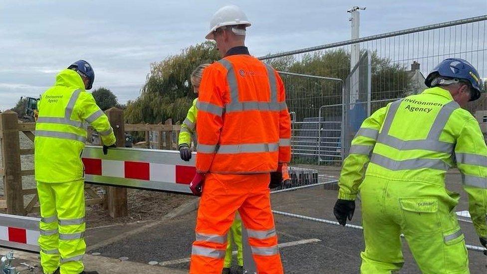 Environment Agency staff training with Jackson Civil Engineering to put the demountable barrier up