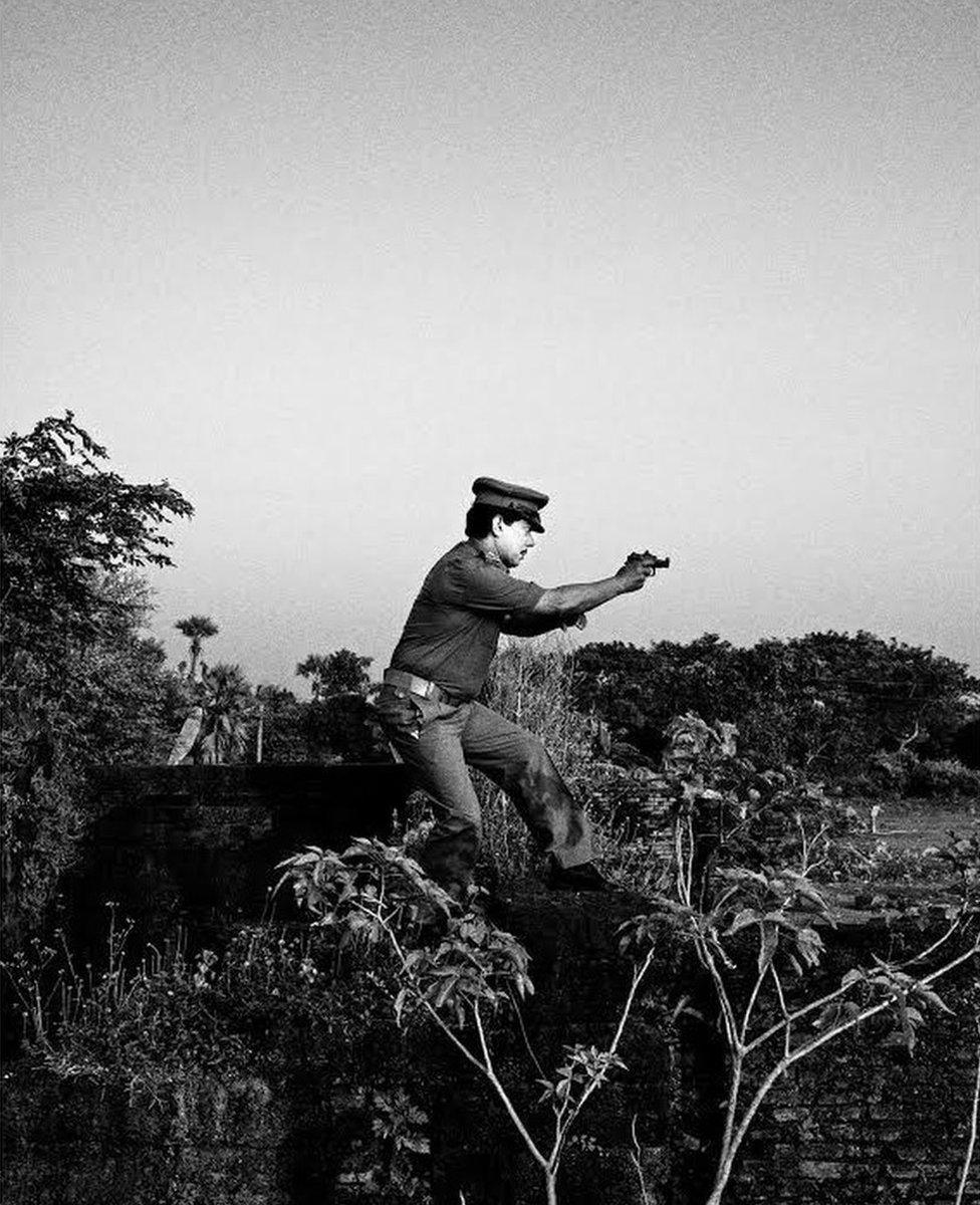 My uncle Shyamal Kr Dihidar(51yrs) in costume as a police officer. A Jatra artiste since his childhood, he’s employed in the Indian Railways. Gokulpore, India.