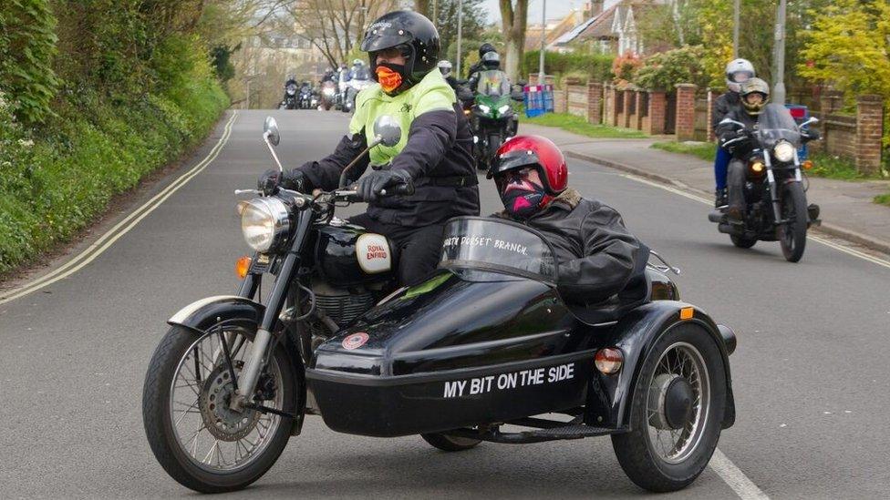 Joe Canning riding in the sidecar of the Royal Enfield motorcycle