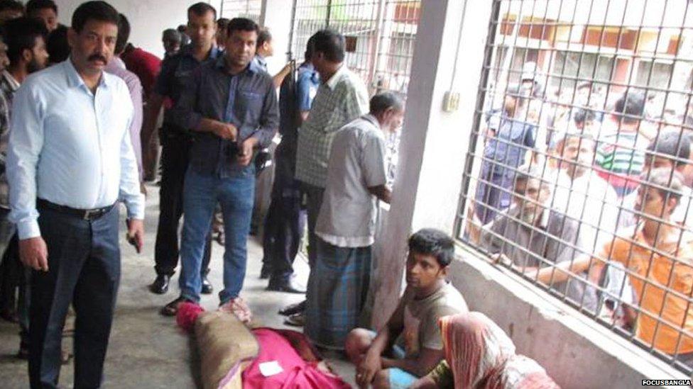 Bangladeshi relatives surround the bodies of some of those killed in a stampede