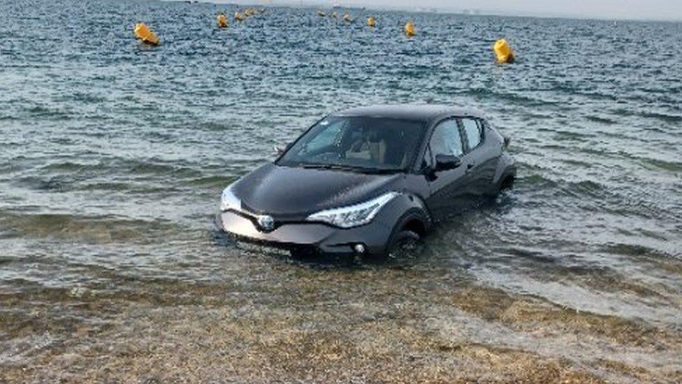 Black Toyota stranded in Shoebury beach, Essex