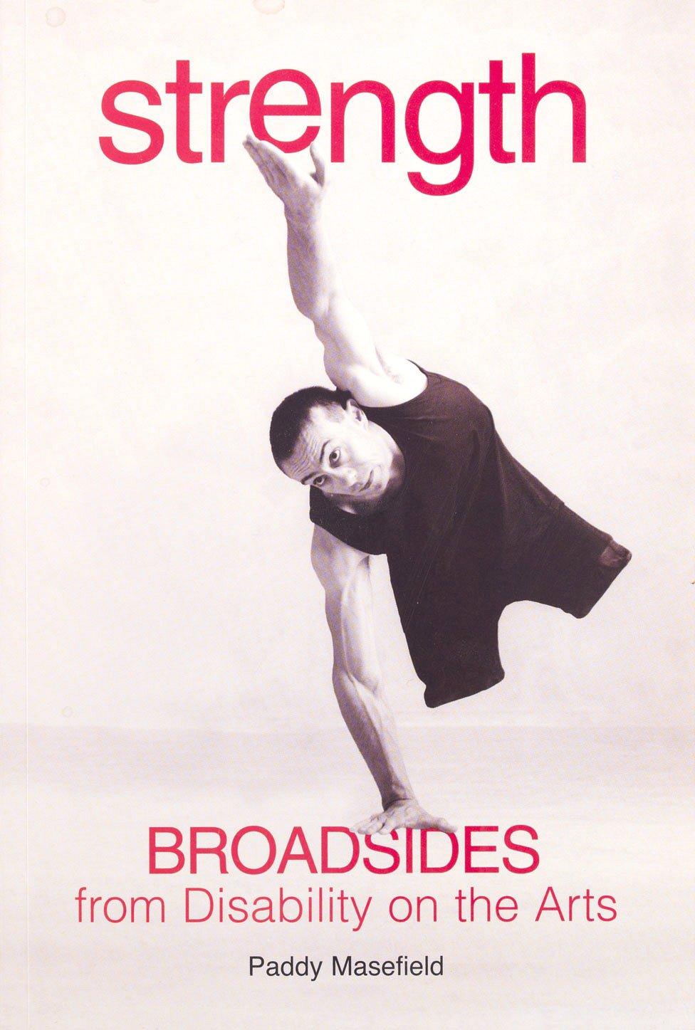 A dancer with no legs balances on one hand. The word 'strength' is positioned at the top of the page as if his other hand is holding it up.