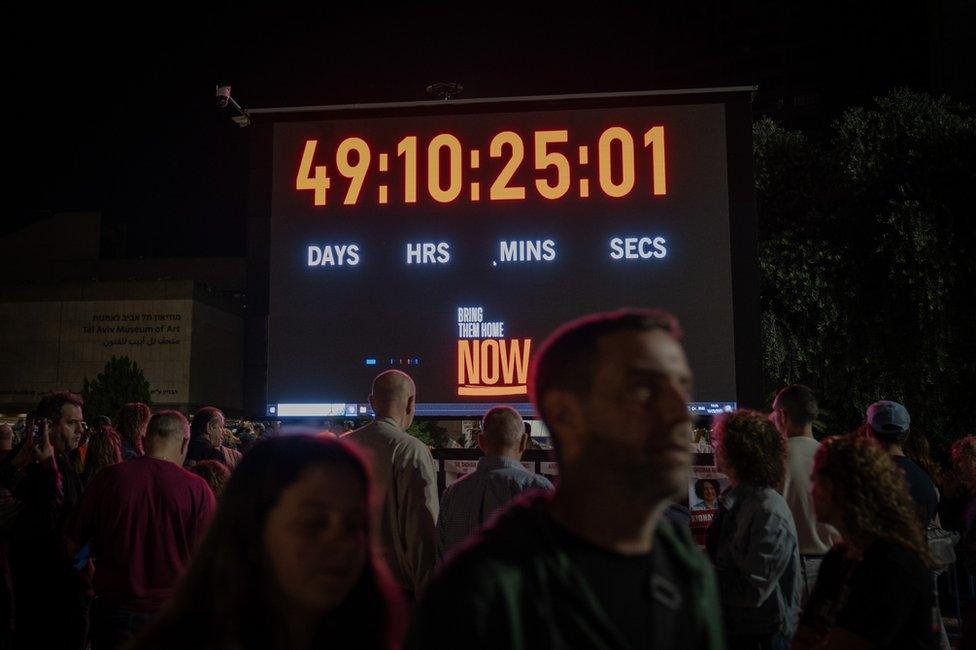 A big screen at the rally on Saturday showed how long the Israeli hostages had been in Gaza.