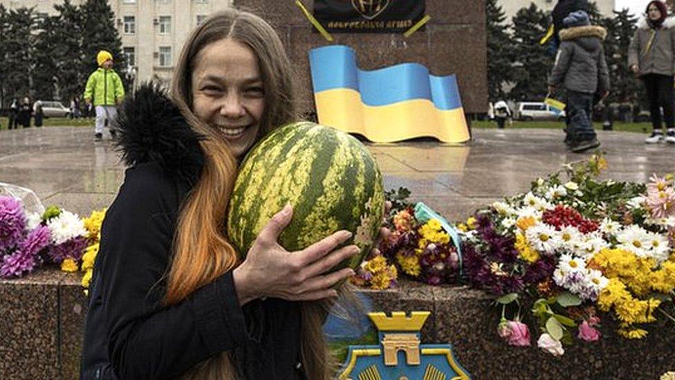 Woman holding watermelon