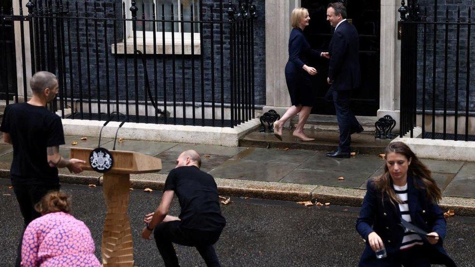 Liz Truss and Hugh O'Leary head towards the Downing Street door