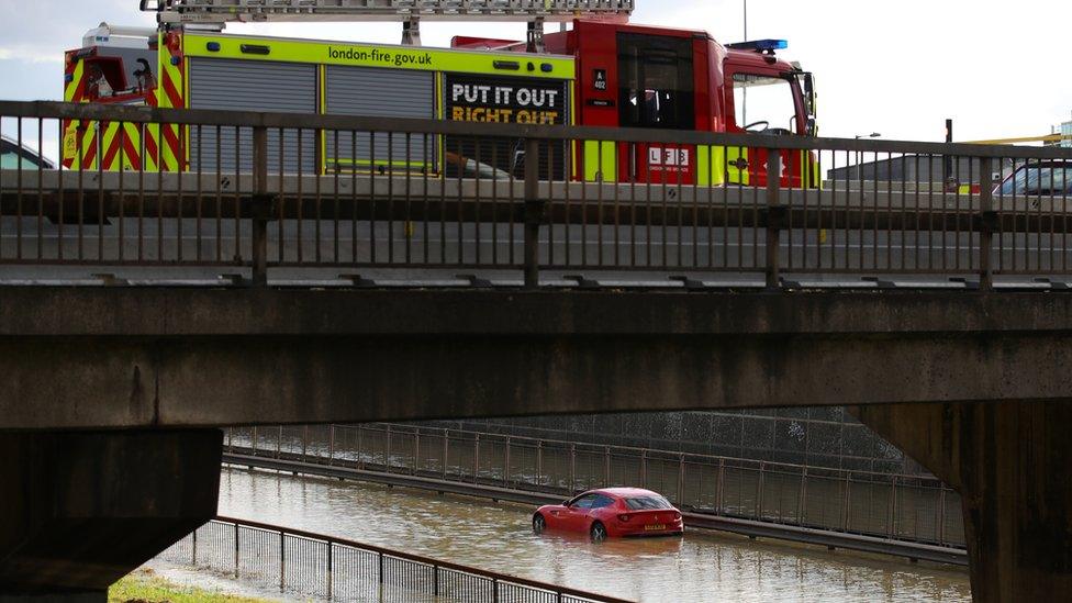 Fire engine surveying a flooded north circular