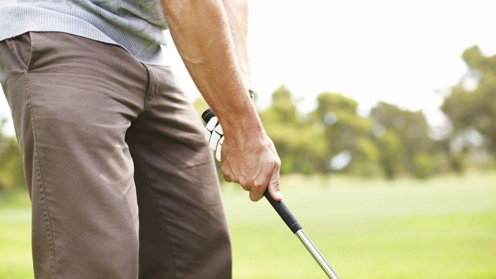 Man holding golf club