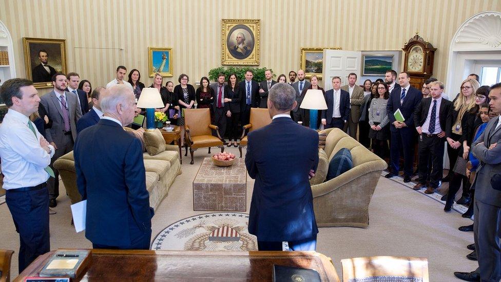 Mr Obama and Joe Biden face dozens of communication staff members, filling the Oval Office, on the day after Donald Trump's election victory.