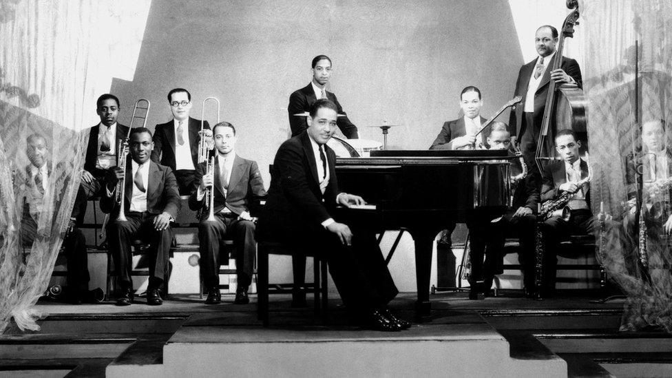 American jazz pianist composer and bandleader Duke Ellington (pictured centre with his orchestra in 1929) rose to fame during the Harlem Renaissance and helped lay the foundation for future generations of black musicians