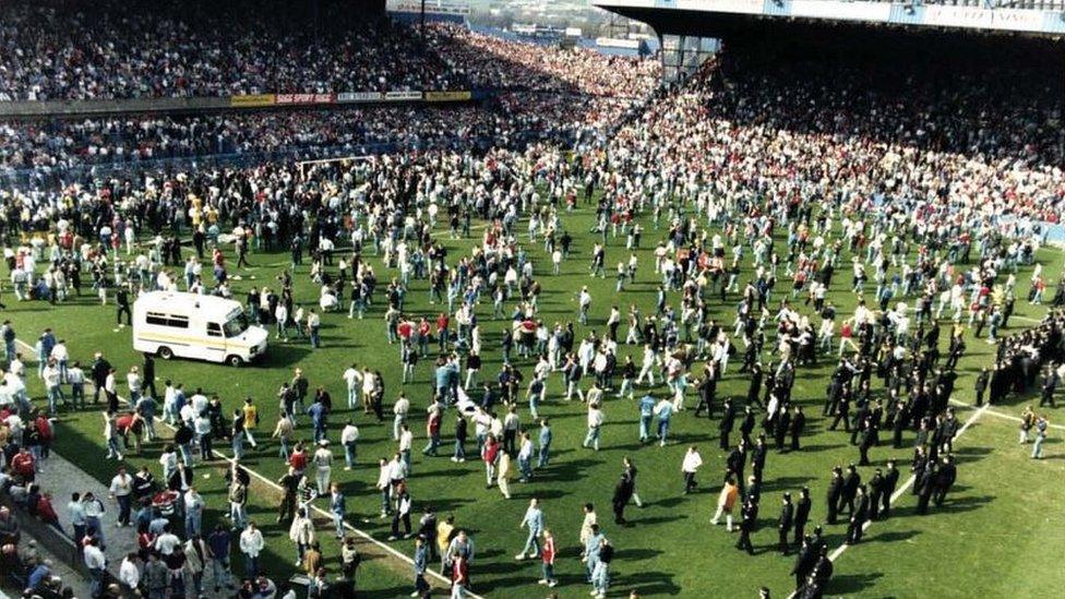 general view of fans on the pitch