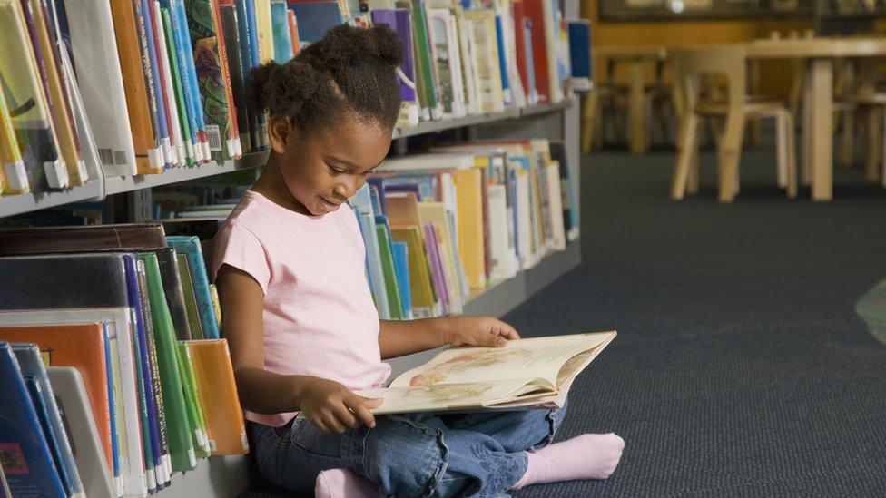 girl-reading-in-library