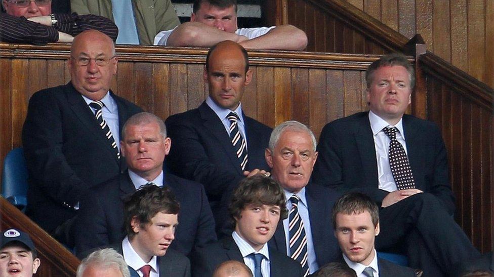 Craig Whyte (right) in the directors" box at Ibrox after he had taken over at Rangers in May 2011, with Martin Bain (back row centre) and Walter Smith (middle row right)