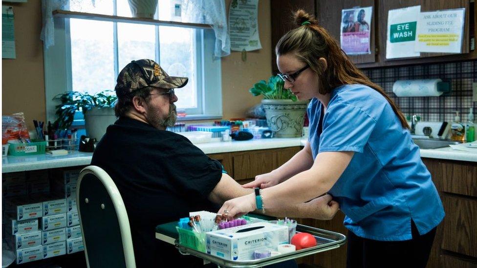 A patient has blood drawn at the Community Health Center of NE Wetzel County March 22, 2017 in Burton, West Virginia.