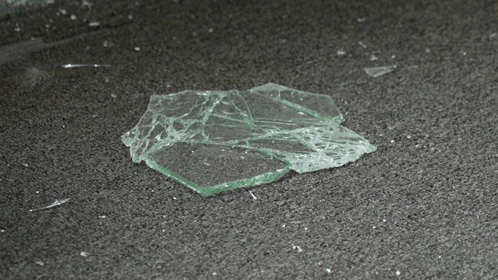 Glass on the floor of car sales business in Ballynahinch