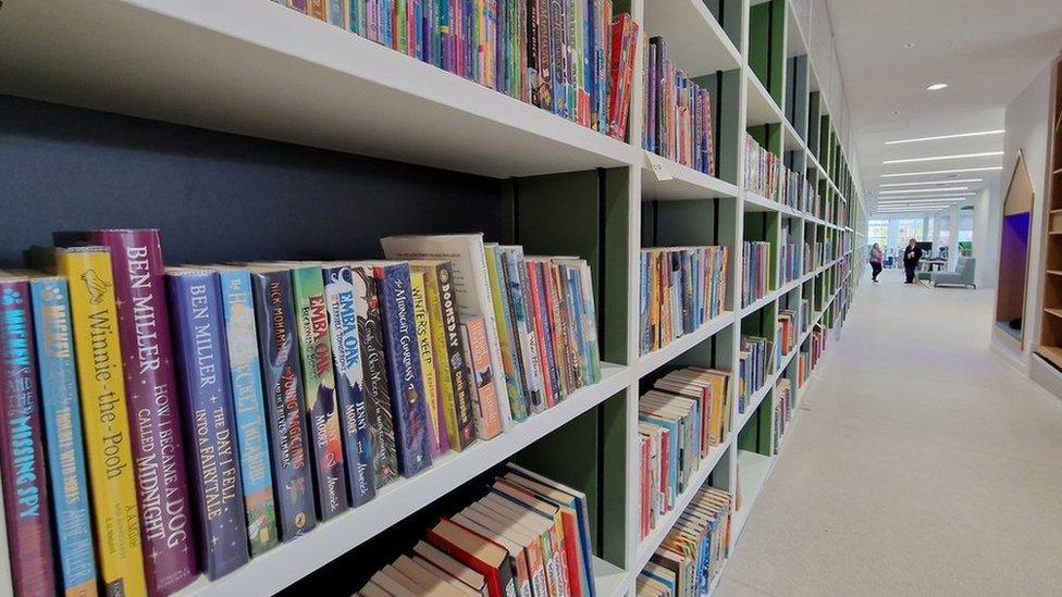 Books on the shelf inside the new library