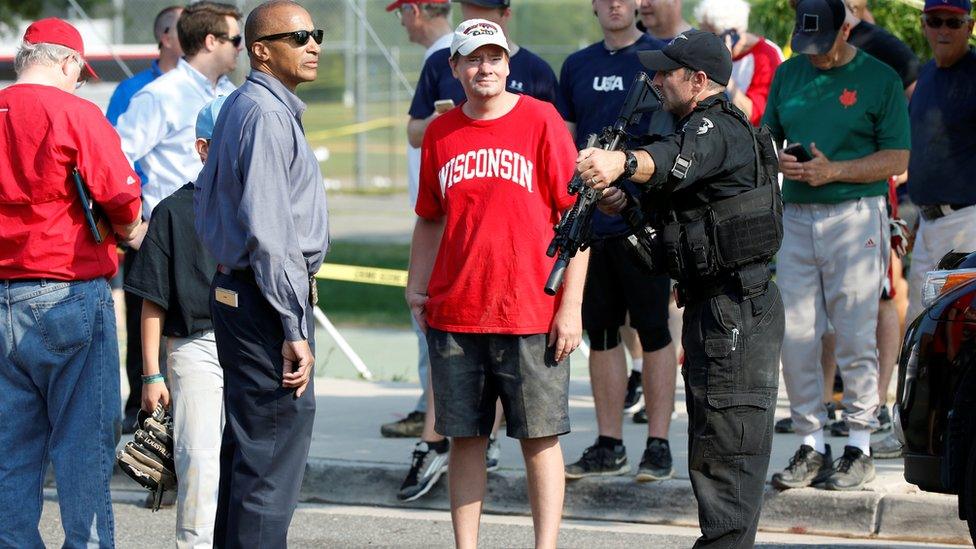 Police investigate a shooting scene after a gunman opened fire on Republican members of Congress during a baseball practice near Washington in Alexandria